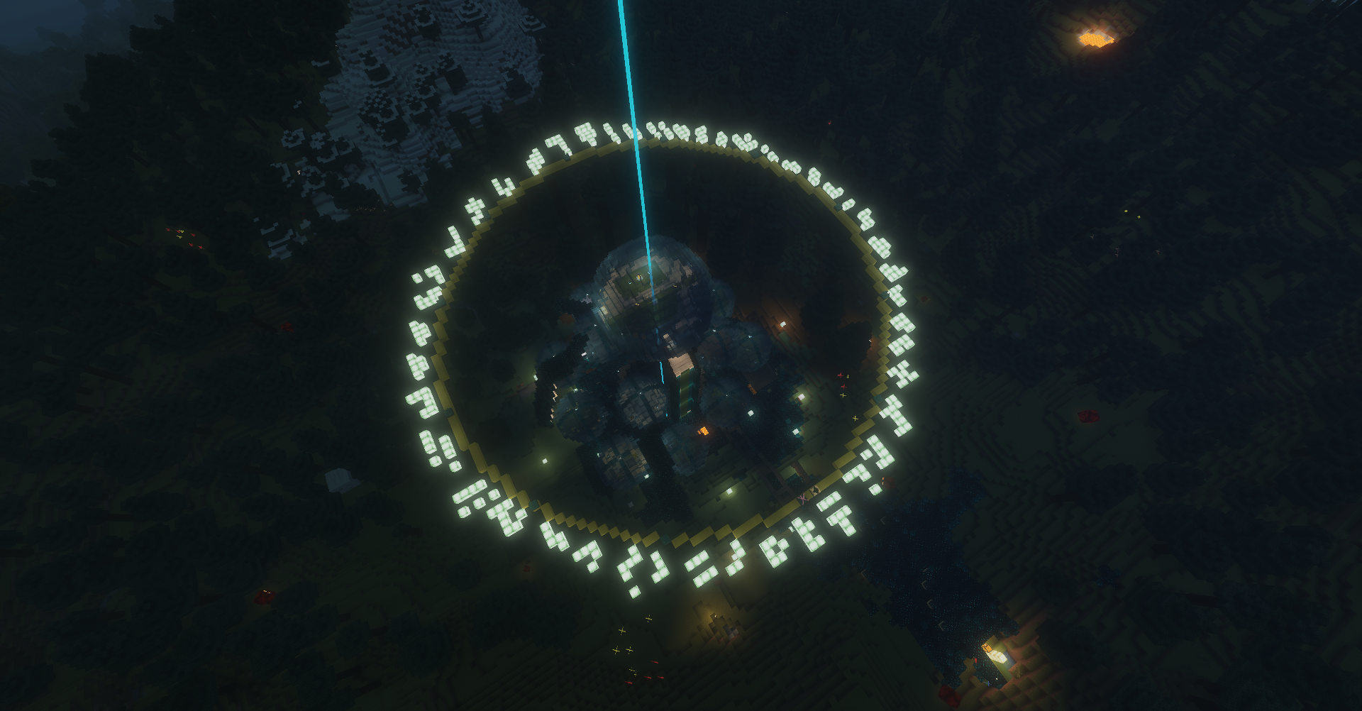 Top-down night view of a lit circular build area